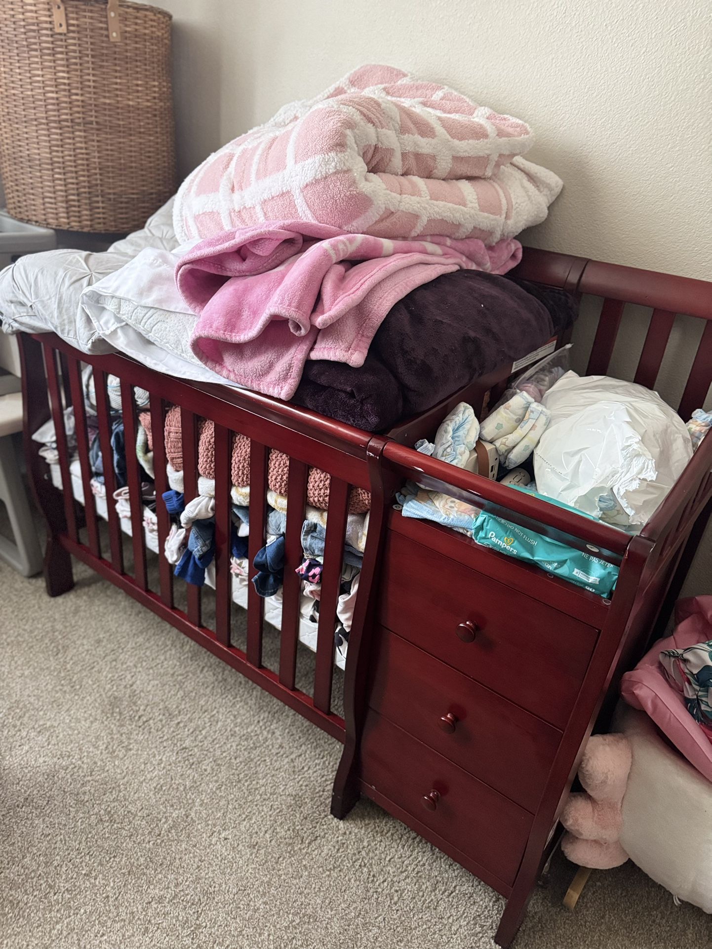 Gently used baby crib mainly used for storage and a free rocking chair (swan) as a bonus