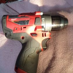 12 volt Milwaukee hammer drill two speeds no battery has charger 50