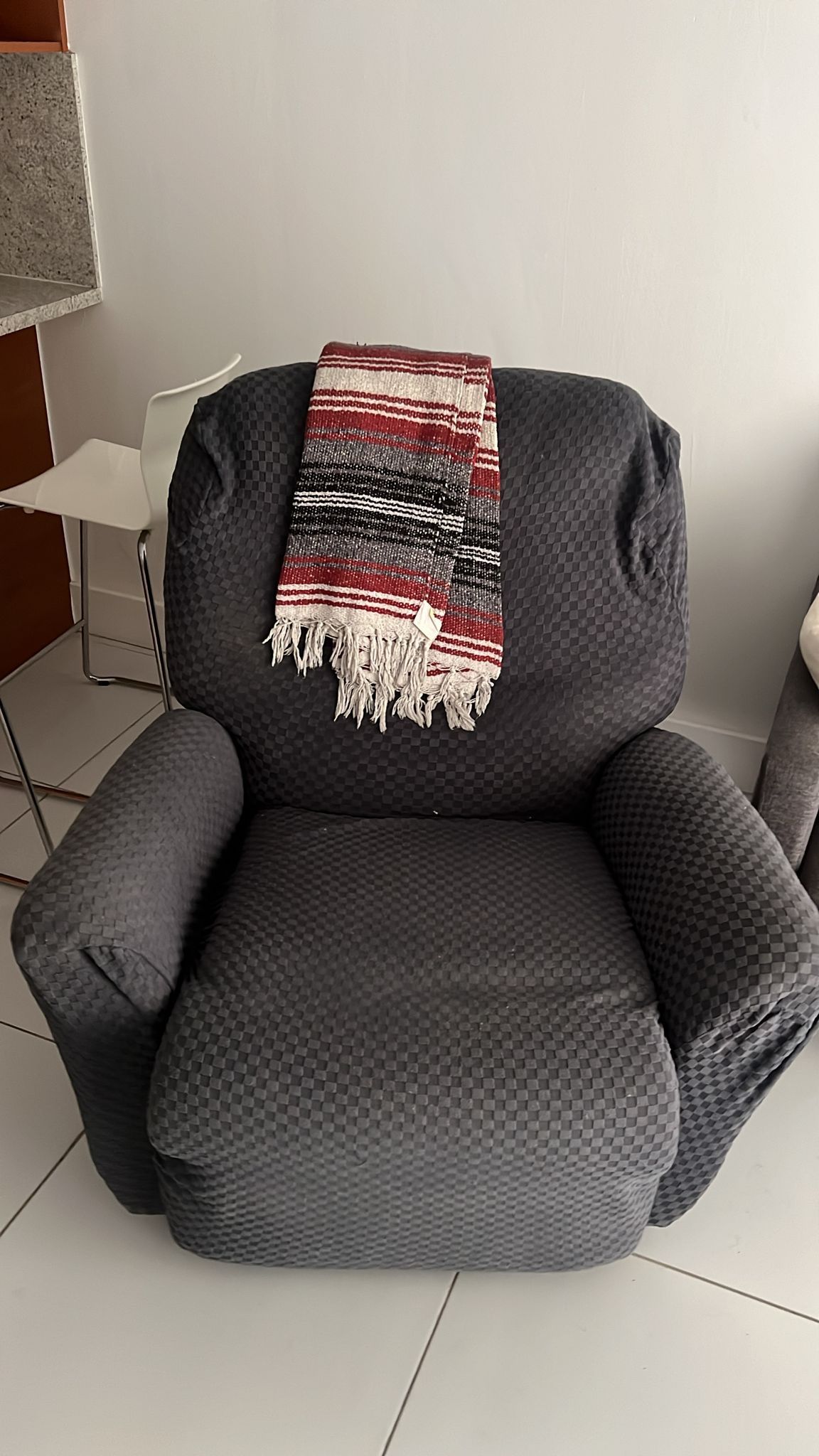 Beige Recliner With Blue Cover