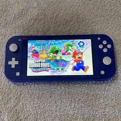 NINTENDO SWITCH LITE + 100 SWITCH GAMES