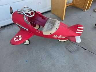 Vintage pedal plane pedal car