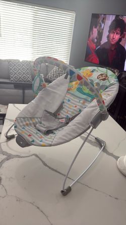 Bright starts vibrating bouncer with toy bar