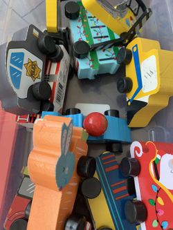 Assorted wooden toy cars