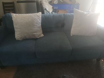 Blue couch with single seat