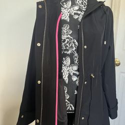 Black Short Woman’s Coat Size Large. Waterproof. Pleats in the back. New With Tags. Reg Price $195. Jessica Simpson. Comes from a smoke free environme