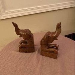 A pair of Vintage hand carved Hardwood Elephant Bookend .