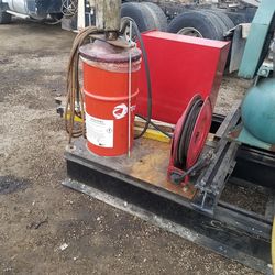 Pump and luber reel with hose. $1100.00 pump at cost is 1500.00.