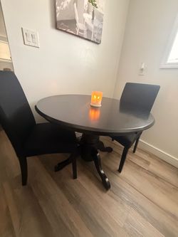 Black dining table and chairs