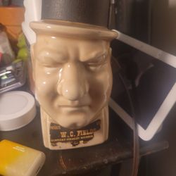 This vintage W.C. Fields Kentucky Straight Bourbon Whiskey decanter is a collectible item. 