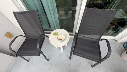 Two Metal Chairs/Rusty on bottom legs/Good condition