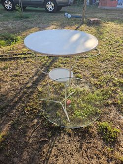 white metal and glass outdoor patio table