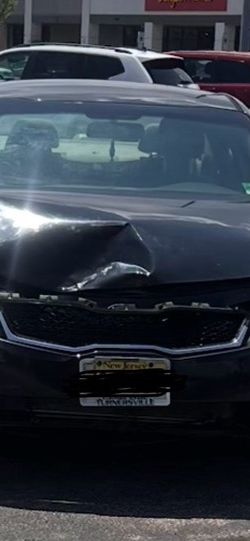 Damaged Black Kia Optima Sedan