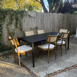 Perigold Dining Set with Black Ethnicraft Bok Oak Table 79” + Four Hands Britt Chairs Set of Six Light Wood with Cane