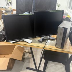 Two Dell Monitors And A Lenovo Tower