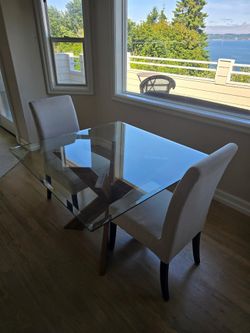 Glass table with two chairs