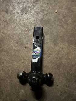 tri-ball trailer hitch ball mount with a hook.