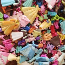 polly pocket accessories and some dolls $10