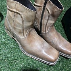 Italian-made brown leather ankle boots featuring a side zipper and a distinctive square toe. The label indicates a size 45 (European sizing), which ty