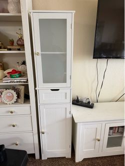 Tall, skinny white cabinet
