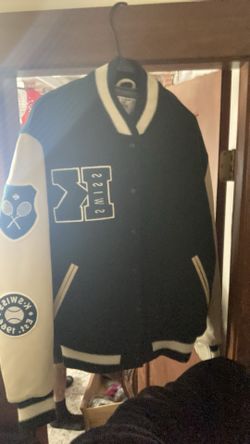 green and light tan  varsity jacket