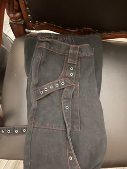 Red threaded black baggy jeans with large side pockets