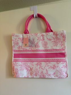 Pink and white canvas handbag