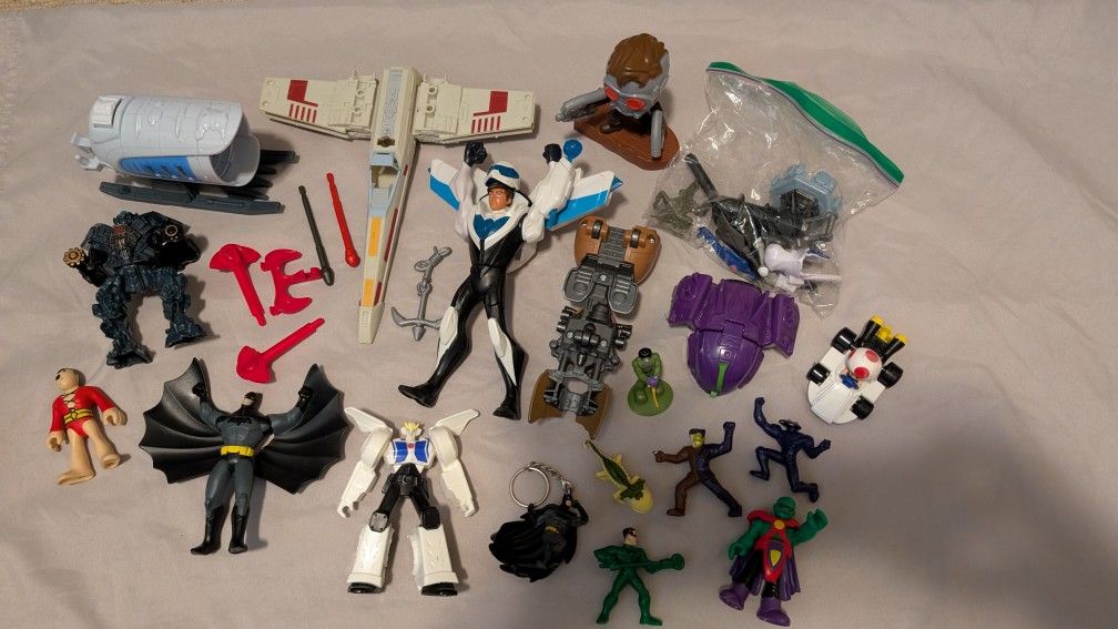 Random lot of action figures and toys.
There's a bunch of Batman stuff, ECT..