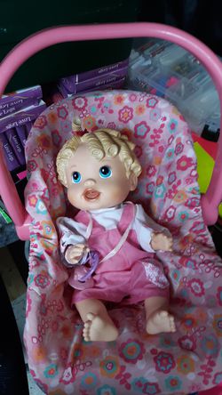 Baby alive with pacifier and carrier