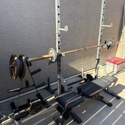 Squat Rack, Weights,bars, And Bench
