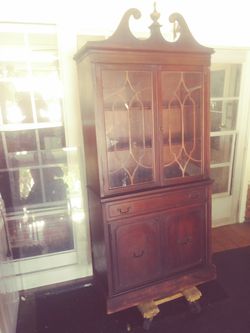Large wood armoire or display case.