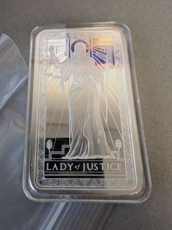 Lady of justice 10 oz silver bar .