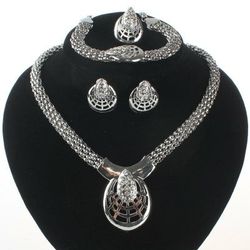 Gold-plated spider web jewelry set. Necklace, earrings, ring and bracelet set.

