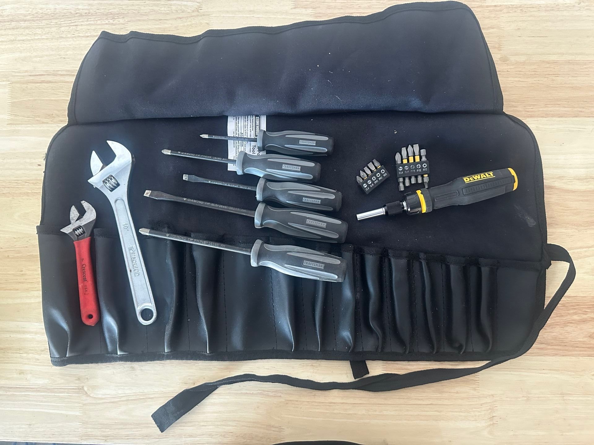 Tool roll with assorted wrenches and screwdrivers