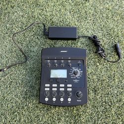 This device is a Bose T1 ToneMatch Audio Engine, a 4-channel digital mixer designed for live performance. 