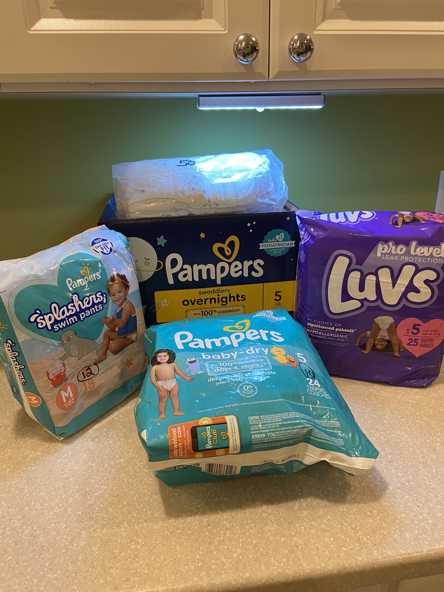 DIAPERS  NEW OVER 100 PAMPERS/LUVS  All size 5