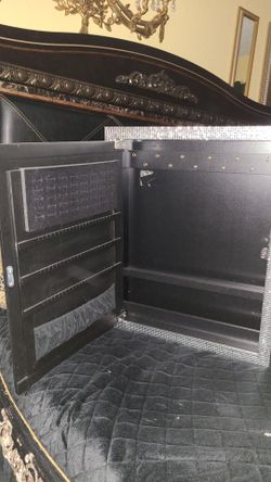 Black  jewelry box with a mirror infront