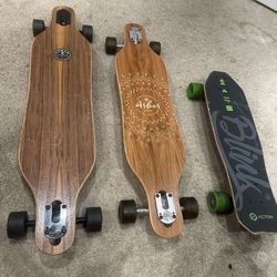 Skateboards - 2 Arbor Long boards And 1 Blink Action Electric Board.