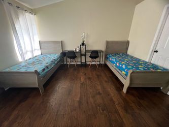 2 twin beds with mattresses
