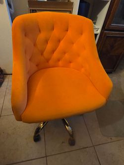 Bright orange velvet office swivel chair