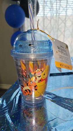 Disney Winnie the Pooh plastic tumbler includes a dome lid, straw, and fruit punch flavored candy sticks.