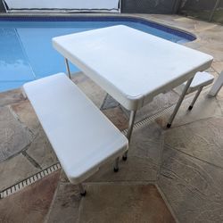 Folding space saving plastic table with benches 