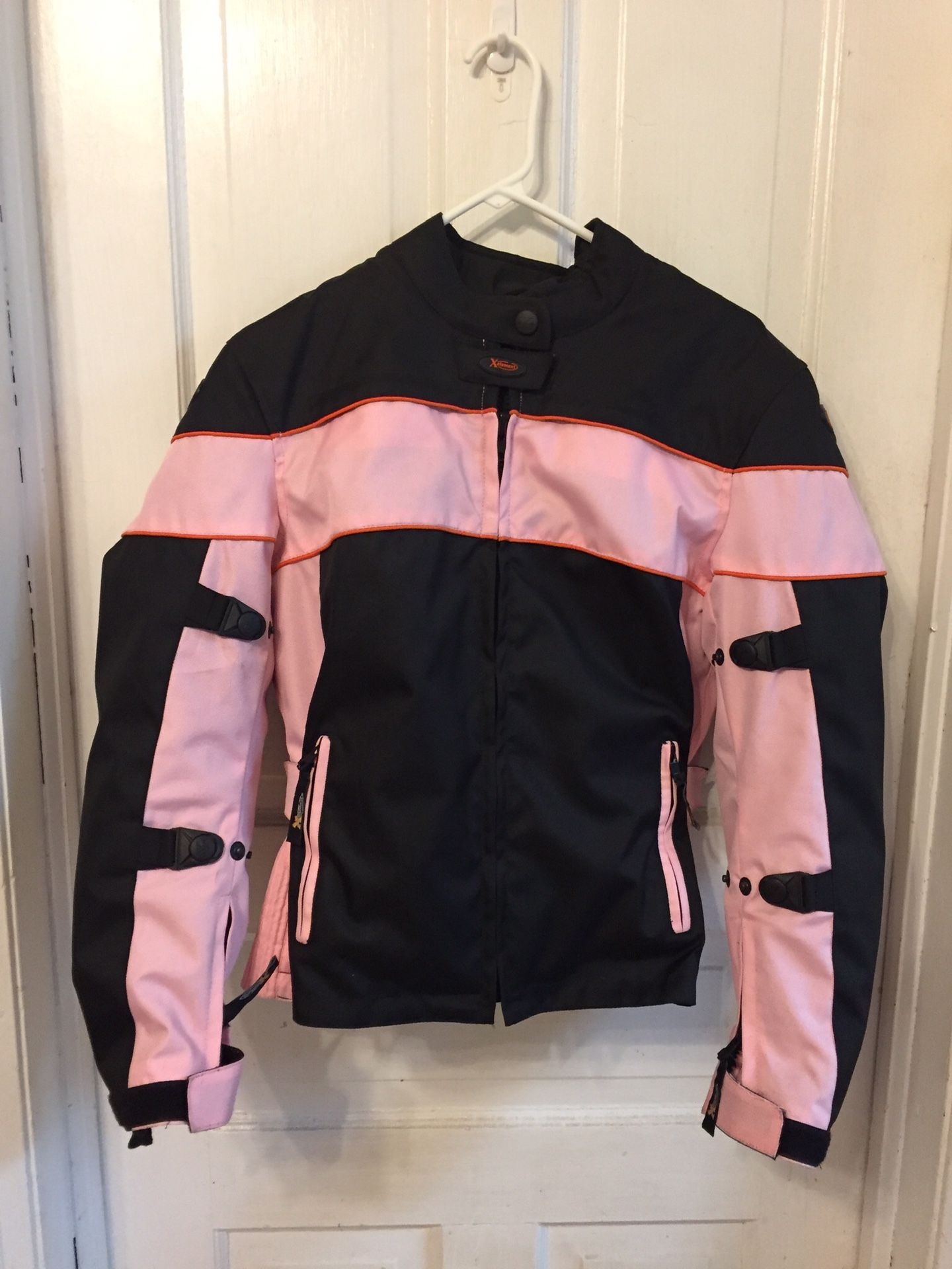 Medium sized women’s motorcycle jacket. Has Level 3 removable armor on shoulders, elbows and back. 100% Tri-Tex material which is waterproof and brea