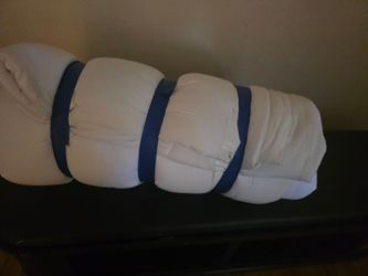 White Comforter Rolled and Strapped