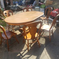 Vintage Tell City 4-column pedestal table with casters and 2 leaves and 6 chairs. Make offer