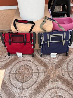 2 low-profile, suitcase-style beach chairs that are easy to open and close.