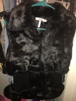 Size Large Brand new never worn fur vest