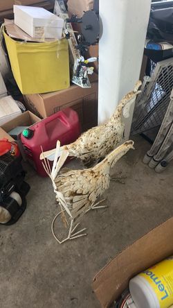 2 rusty metal chickens
