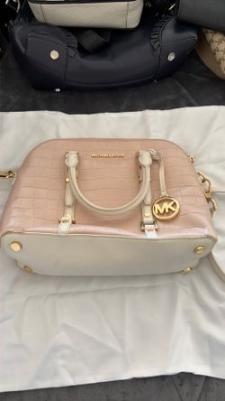 This light pink Michael Kors Bedford Legacy Dome satchel features a distinctive crocodile-embossed leather finish and gold-tone hardware.