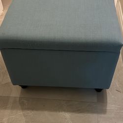 light blue upholstered storage ottoman