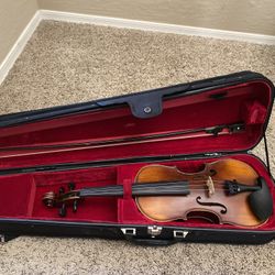 Violin-comes with extra strings. $100. Higley and ray. 